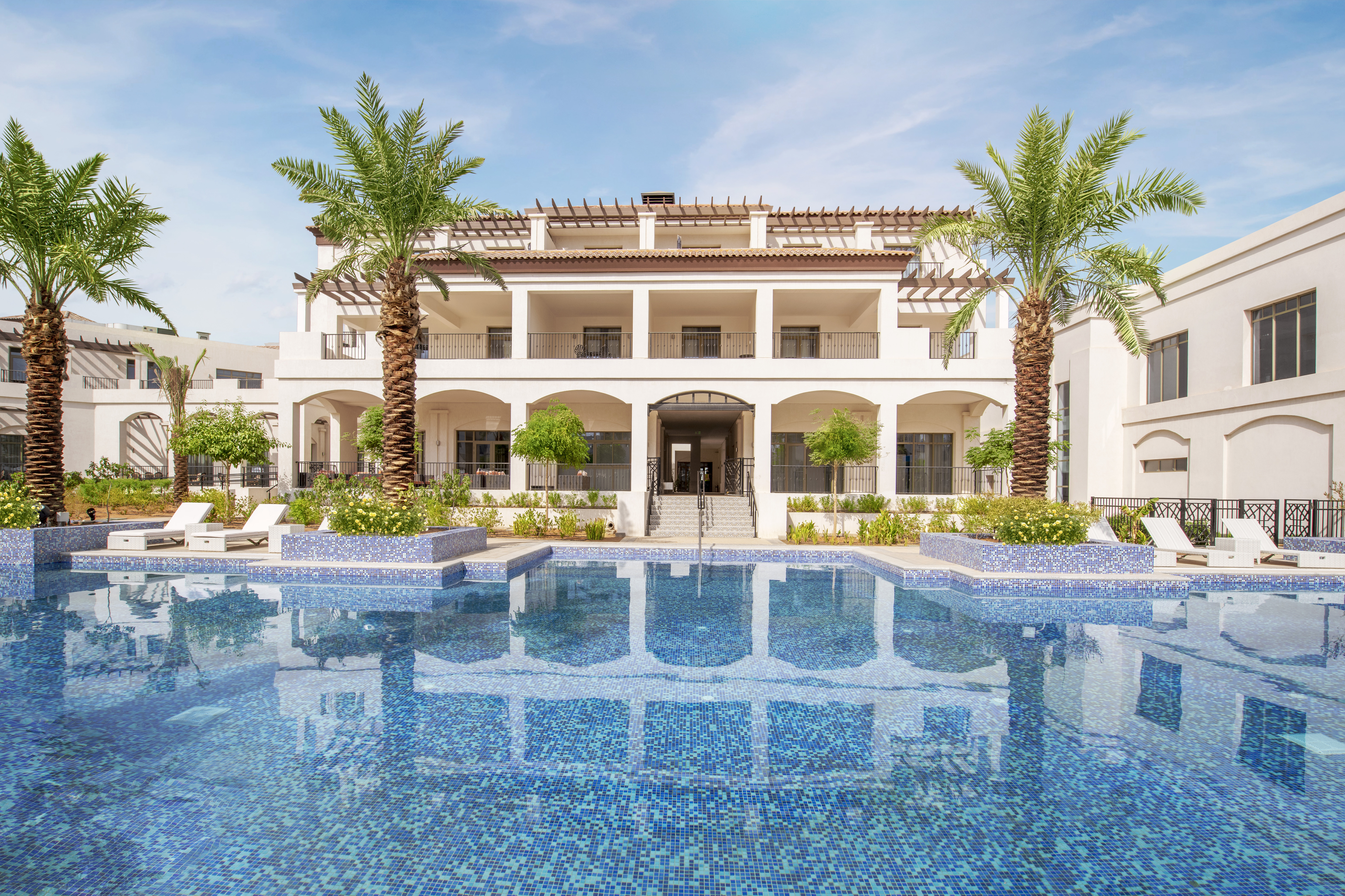 Antara Clubhouse exterior overlooking pool

