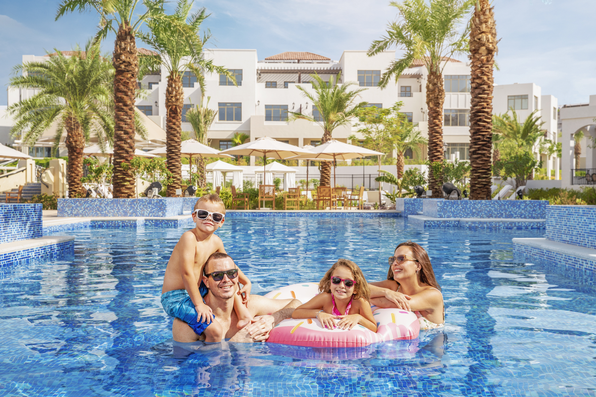 Family swimming in Antara pool